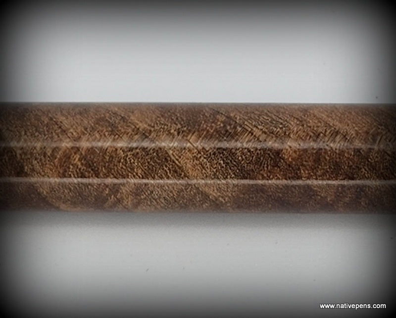 close up of walnut pen blank showing figure